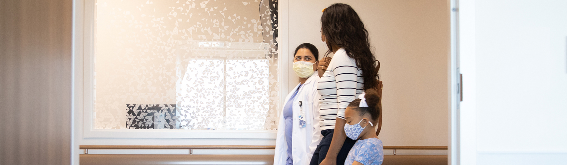 Family walking through hospital