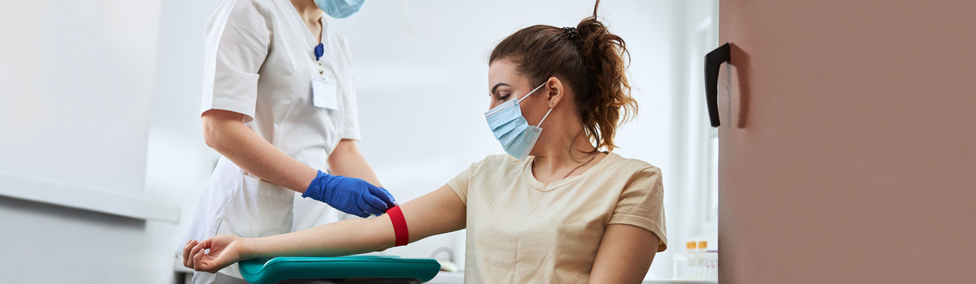 Patient getting her arm bandaged