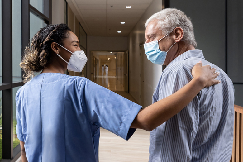 Nurse Walking with Senior Patient
